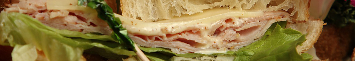 Eating Deli Italian Sandwich at Vincenzo's Italian Deli restaurant in Dedham, MA.
